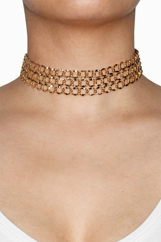 gold choker necklace on model
